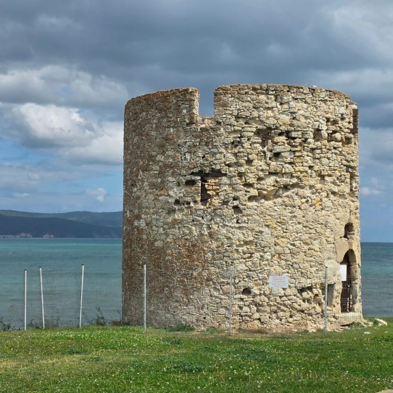 Photo of London gherkin building on the right and two construction cranes on the left. 